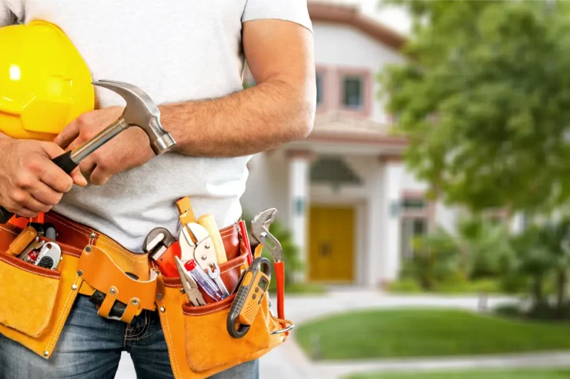 young-man-worker-with-tool-belt-helmet
